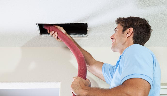 professional man air duct cleaning and sealing service